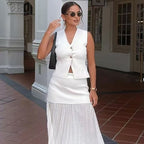 Manelia | Gouden knoop gebreid vest en lange rok